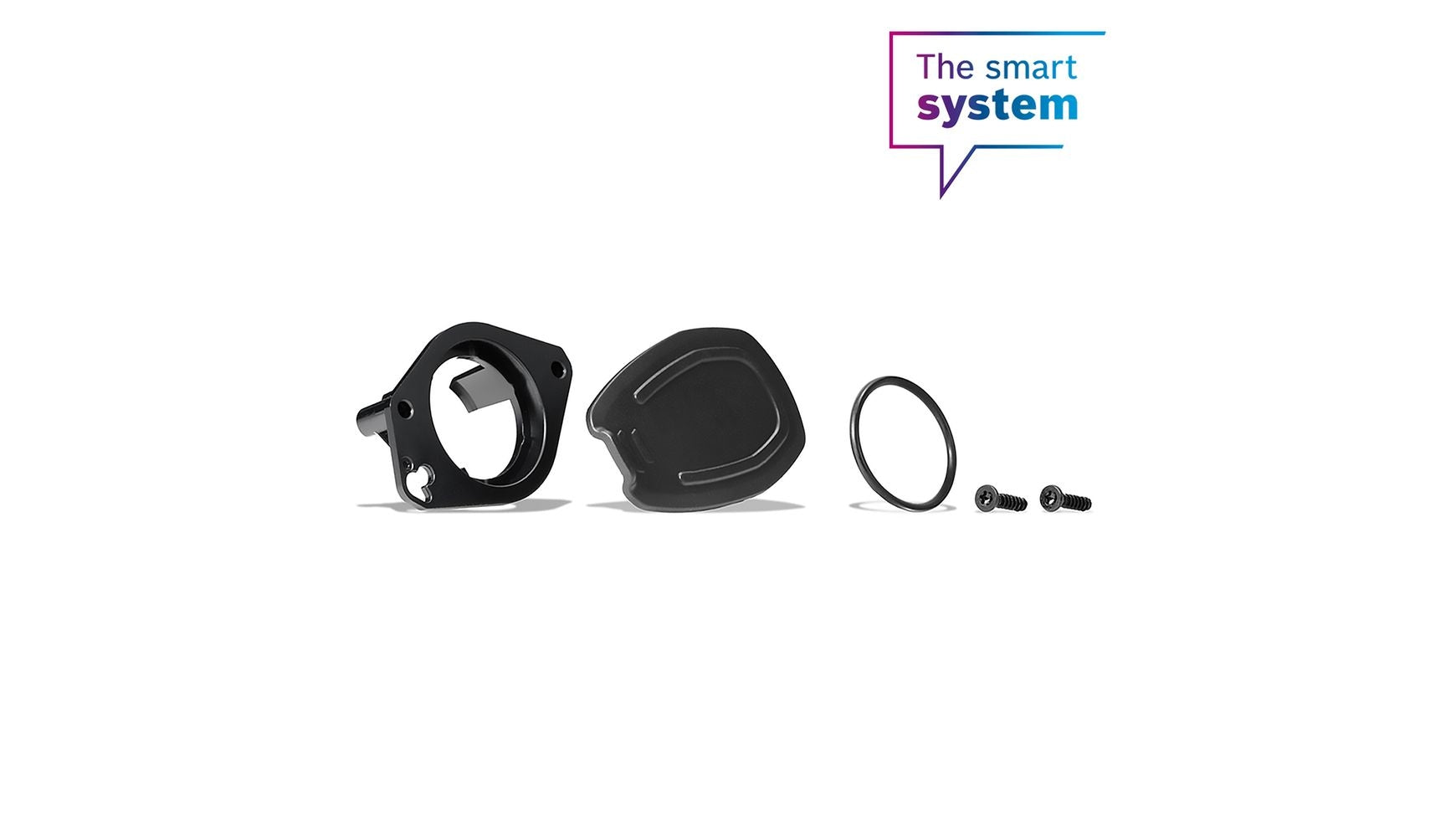 Das BOSCH Montage-Kit Ladebuchsenhalter enthält eine schwarze Halterung, eine Abdeckung, einen O-Ring und zwei Schrauben für Ihr E-Bike, abgebildet auf weißem Hintergrund mit dem Text "The smart system" in der oberen rechten Ecke.